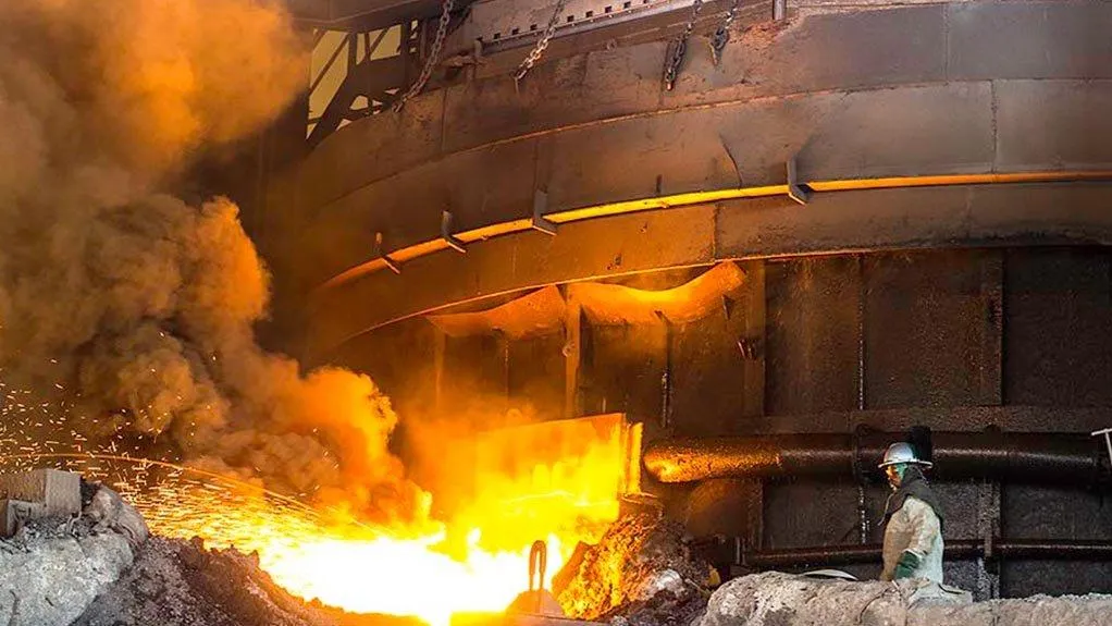 Ferroalloy furnace tapping with sparks and fumes