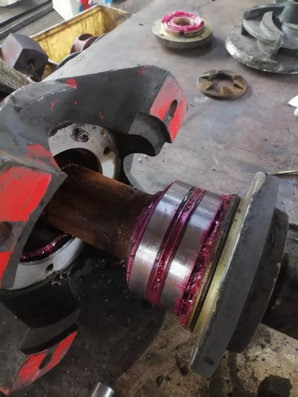 Worn pump shaft and bearing as received for repair