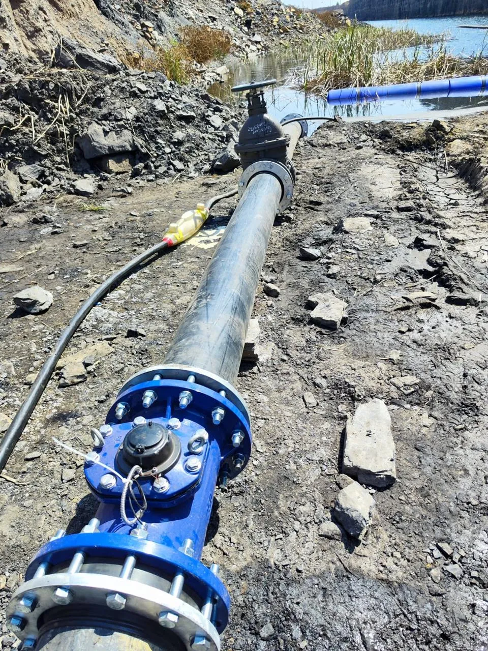Damaged pipeline with gate valve and flanged fittings on site